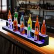 Suport bauturi cu 2 trepte, Iluminare led RGB, Telecomanda si App, USB, retea sau Power Bank, 1210x200x150 mm, Portabil, Acril
